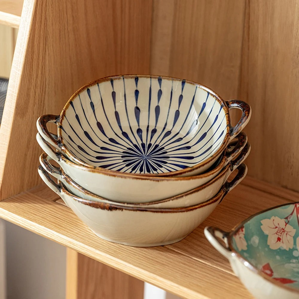 Stack of ceramic bowls with decorative patterns on a wooden shelf