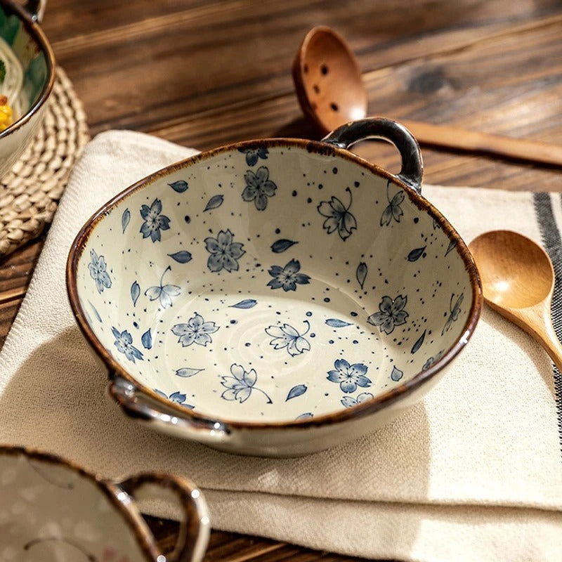 Ceramic bowl with floral pattern on a wooden surface